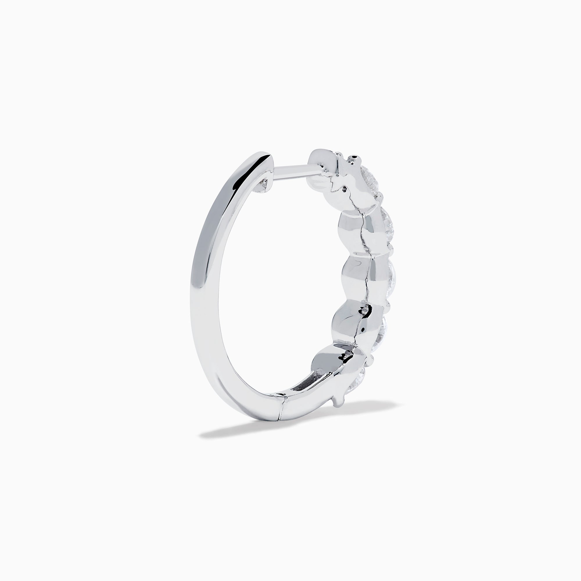 The Classique 14K White Gold Diamond Hoop Earrings feature five round diamonds on each hoop, shown against a white background for a timeless look.