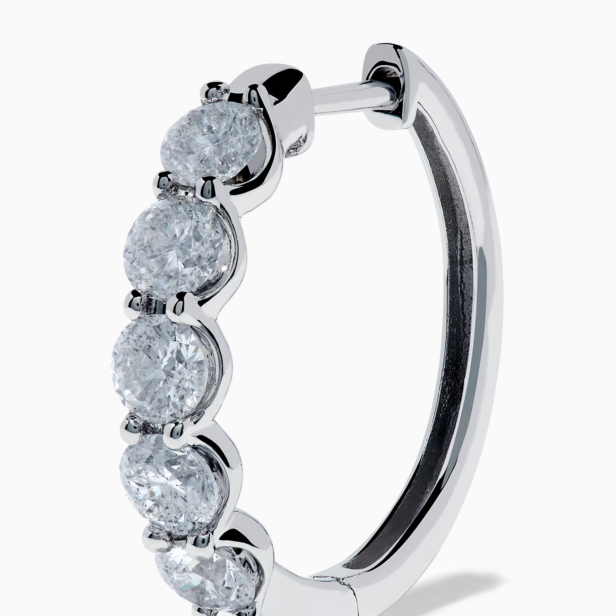 The Classique 14K White Gold Diamond Hoop Earrings feature five round diamonds on each hoop, shown against a white background for a timeless look.