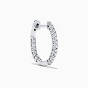 The 14K White Gold Pave Diamond Hoop Earrings 5/8" feature sparkling pave diamonds set in an elegant white gold hoop, displayed on a plain white background.