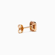 The Espresso 14K Rose Gold Brown and White Diamond Stud Earrings feature a central brown and white diamond with clear crystal accents, set in square-shaped studs.