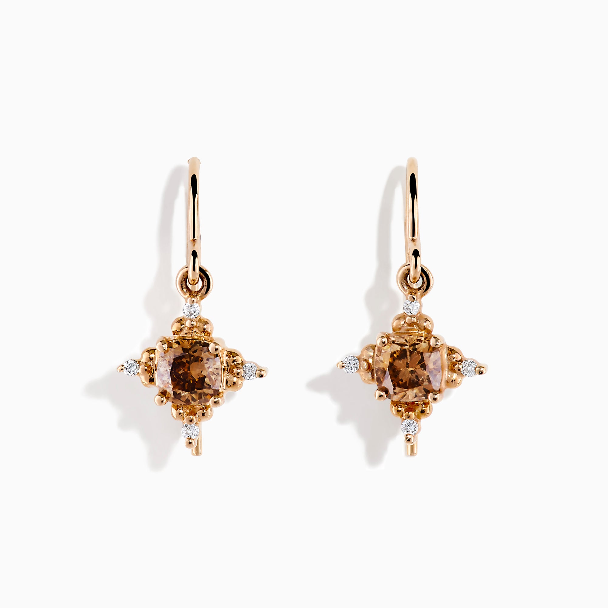 The 14K Rose Gold Brown and White Diamond Dangle Earrings feature a central brown diamond surrounded by white diamonds, each earring hanging from a simple rose gold hook.
