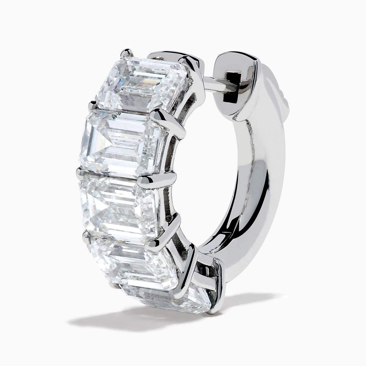 A pair of Lab Grown Emerald Cut Diamond Huggie Earrings in 14K white gold, each featuring three vertically-set rectangular clear stones, is displayed against a plain white background.