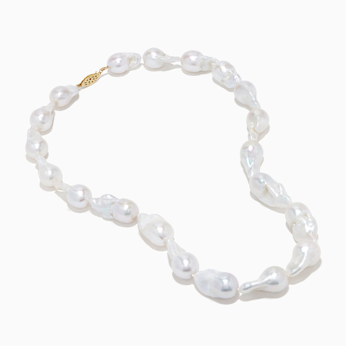 A close-up of the 14K Yellow Gold Freshwater Baroque Pearl Necklace featuring irregularly shaped white pearls and a 14K yellow gold clasp, set against a white background.