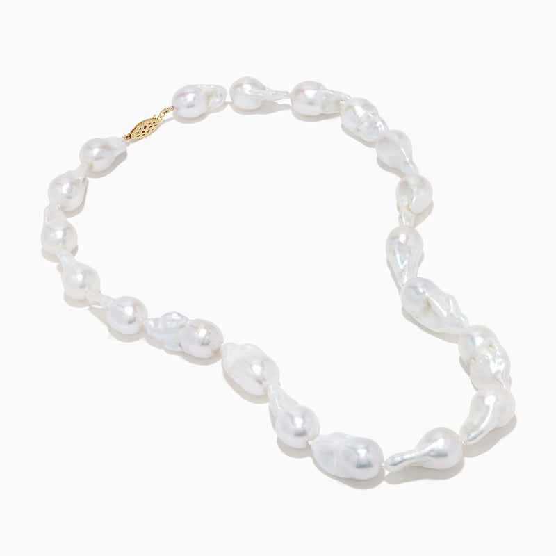 A close-up of the 14K Yellow Gold Freshwater Baroque Pearl Necklace featuring irregularly shaped white pearls and a 14K yellow gold clasp, set against a white background.