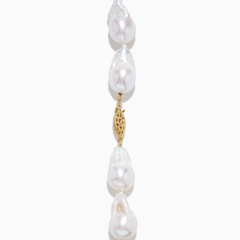 A close-up of the 14K Yellow Gold Freshwater Baroque Pearl Necklace featuring irregularly shaped white pearls and a 14K yellow gold clasp, set against a white background.