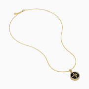 The Novelty 14K Yellow Gold Black Onyx, White and Black Diamond Compass Pendant features a gold chain and round compass design with sparkling stones, shown against a plain white background.