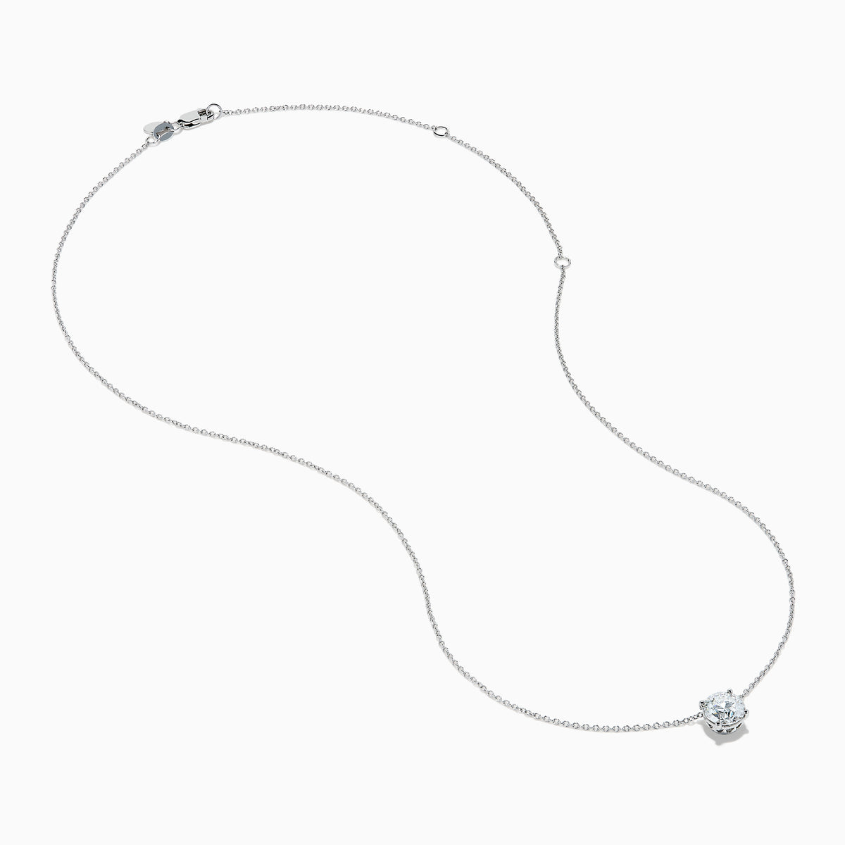 The Star Lab Grown Diamond Solitaire Pendant in 18K White Gold features a single round diamond on a delicate chain, showcased against a plain white background.