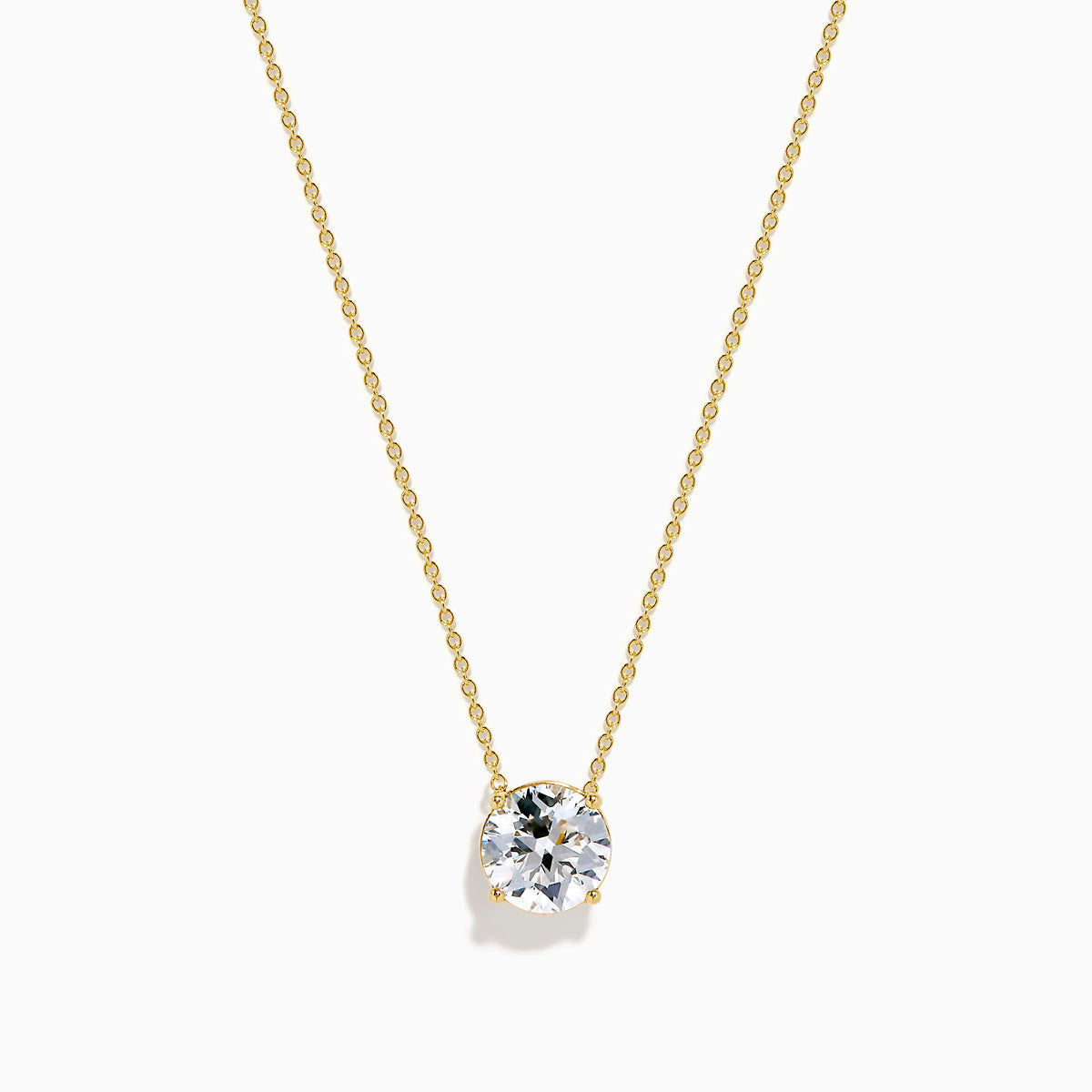The Star Lab Grown Diamond Solitaire Pendant in 18K yellow gold features a fine chain with a single round lab diamond at the center.