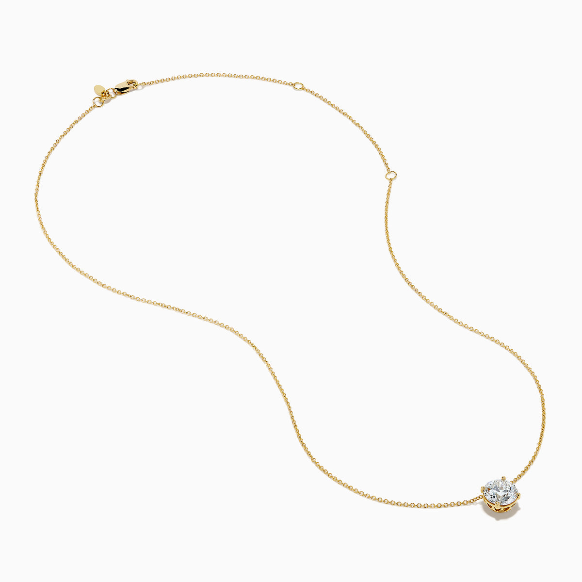 The Star Lab Grown Diamond Solitaire Pendant in 18K yellow gold features a fine chain with a single round lab diamond at the center.