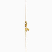 The Star Lab Grown Diamond Solitaire Pendant in 18K yellow gold features a fine chain with a single round lab diamond at the center.