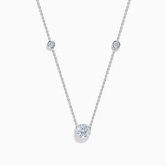 The Star Lab Grown Diamond Necklace in 18K White Gold features three round bezel-set lab diamonds spaced along a silver-like chain, with the largest diamond centered at the bottom for an elegant look.