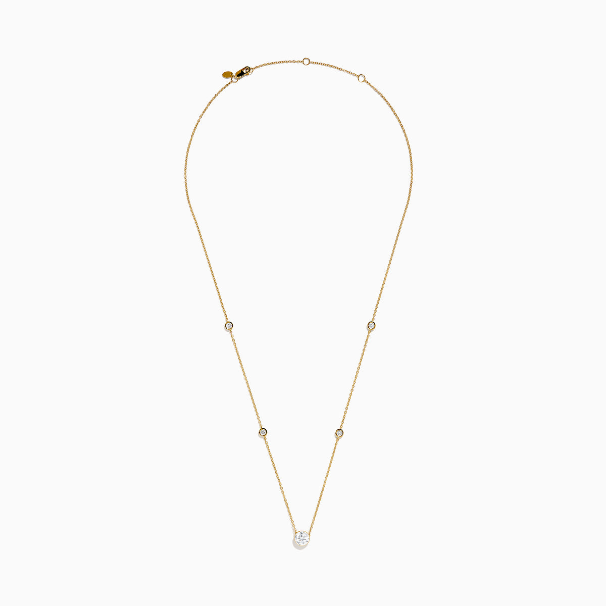 The Star Lab Grown Diamond Necklace in 18K Yellow Gold features a delicate chain with three round, bezel-set diamonds—a larger center diamond and two smaller diamonds evenly spaced along the chain.