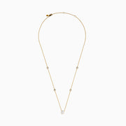 The Star Lab Grown Diamond Necklace in 18K Yellow Gold features a delicate chain with three round, bezel-set diamonds—a larger center diamond and two smaller diamonds evenly spaced along the chain.