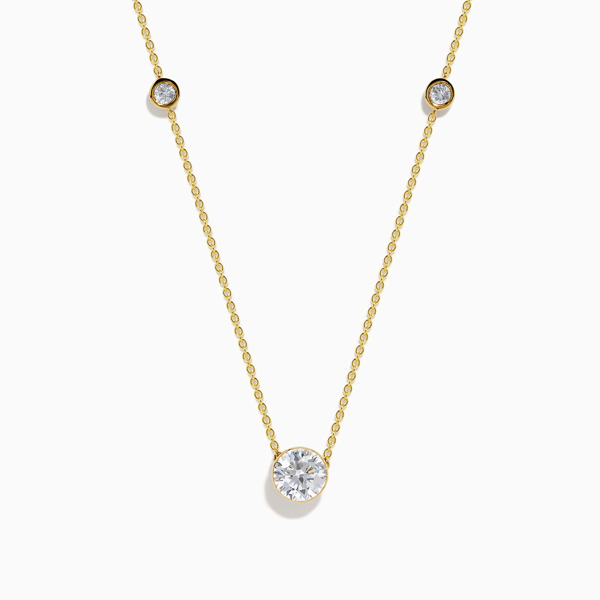 The Star Lab Grown Diamond Necklace in 18K Yellow Gold features a delicate chain with three round, bezel-set diamonds—a larger center diamond and two smaller diamonds evenly spaced along the chain.