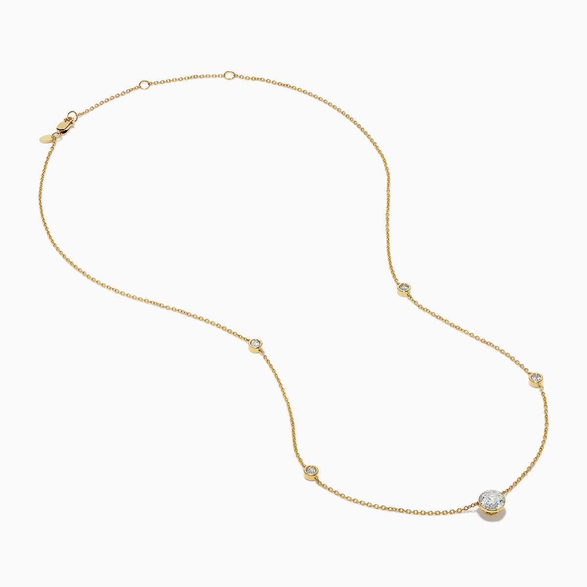 The Star Lab Grown Diamond Necklace in 18K Yellow Gold features a delicate chain with three round, bezel-set diamonds—a larger center diamond and two smaller diamonds evenly spaced along the chain.