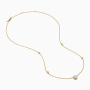 The Star Lab Grown Diamond Necklace in 18K Yellow Gold features a delicate chain with three round, bezel-set diamonds—a larger center diamond and two smaller diamonds evenly spaced along the chain.
