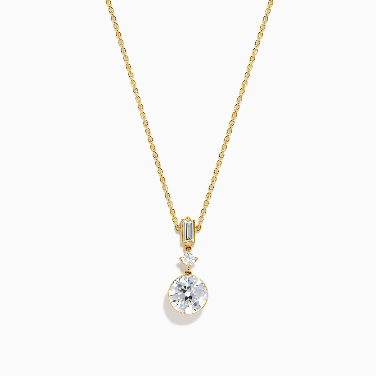 The Star Lab Grown Diamond Classic Station Necklace in 18K yellow gold features a vertical baguette-cut stone, a small round diamond, and a larger round brilliant-cut gemstone pendant.