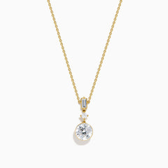 The Star Lab Grown Diamond Classic Station Necklace in 18K yellow gold features a vertical baguette-cut stone, a small round diamond, and a larger round brilliant-cut gemstone pendant.