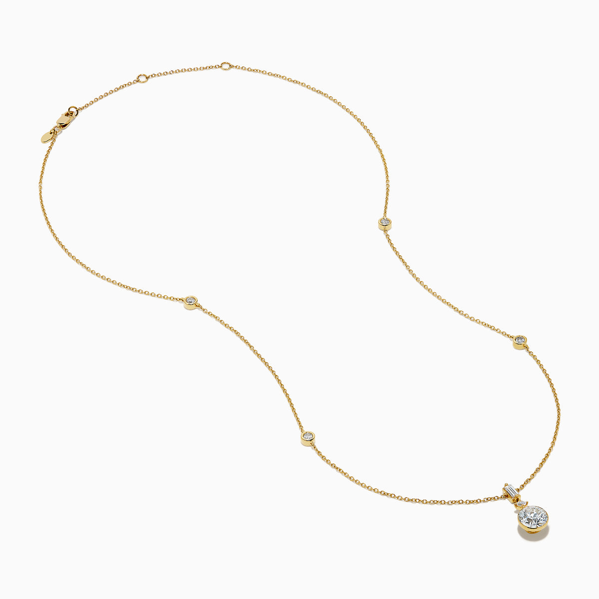 The Star Lab Grown Diamond Classic Station Necklace in 18K yellow gold features a vertical baguette-cut stone, a small round diamond, and a larger round brilliant-cut gemstone pendant.