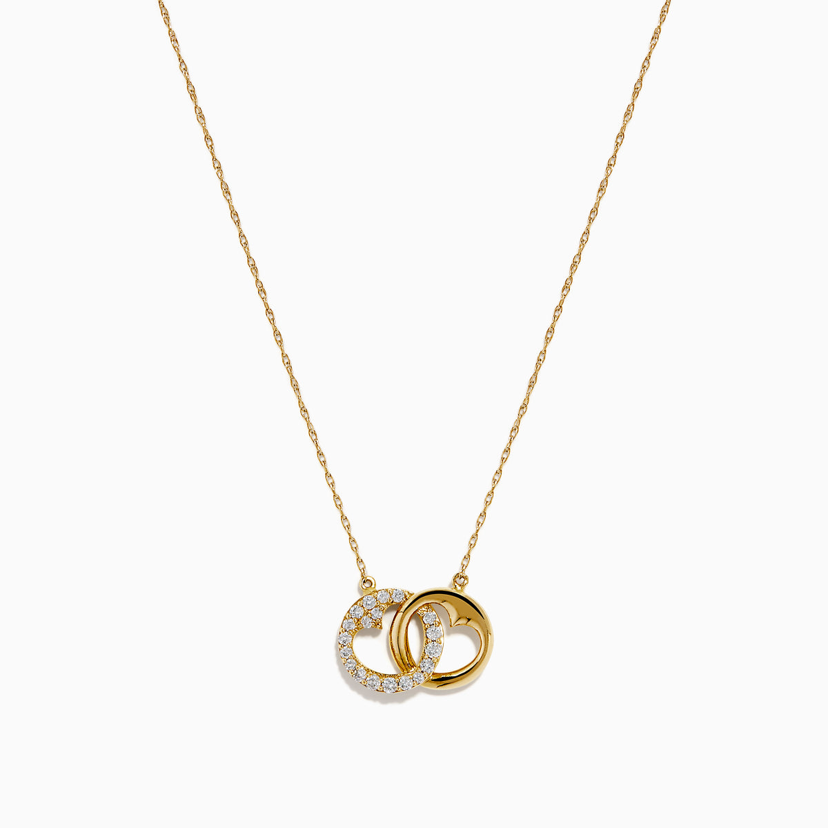 14K Yellow Gold Diamond Accented Interlocking Hearts Necklace featuring two entwined hearts—one with sparkling diamonds, the other polished smooth—shown on a plain white background.