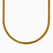 The 14K Yellow Gold Textured Herringbone Chain Necklace 17 features a flat, smooth, and wide U-shaped design displayed against a white background.
