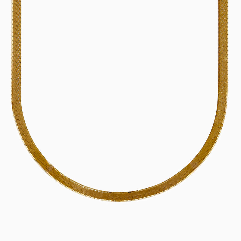 The 14K Yellow Gold Textured Herringbone Chain Necklace 17 features a flat, smooth, and wide U-shaped design displayed against a white background.
