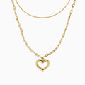 Two gold necklaces are shown: a delicate 14K yellow gold chain and the 14K Yellow Gold Stamp Heart Layered Paperclip Necklace, which features larger links and a heart-shaped pendant. Both pieces are displayed on a plain white background.