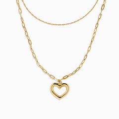 Two gold necklaces are shown: a delicate 14K yellow gold chain and the 14K Yellow Gold Stamp Heart Layered Paperclip Necklace, which features larger links and a heart-shaped pendant. Both pieces are displayed on a plain white background.