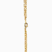 The 14K Yellow Gold Layered Chain Necklace features three delicate chains of different lengths with evenly spaced links, displayed on a white background—a perfect set for achieving effortless elegance.