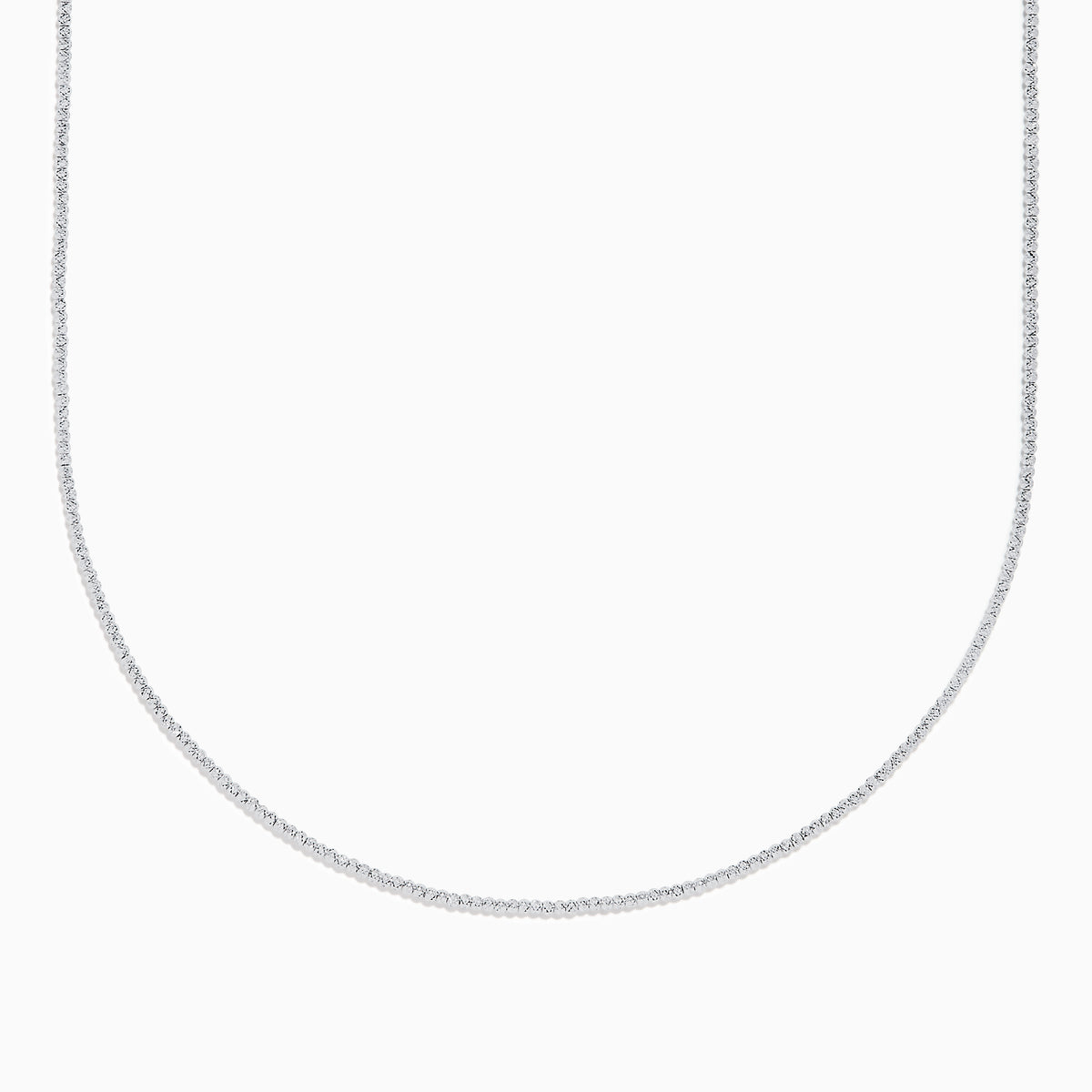 The 14K White Gold Bead Necklace is displayed on a white background, its delicate form creating a graceful curve.