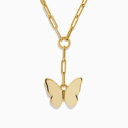 The 14K Yellow Gold Paperclip Butterfly Lariat Necklace features elongated chain links and a central ring with a gleaming butterfly pendant, displayed on a white background.
