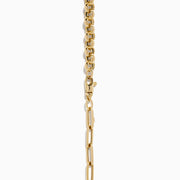 The 14K Yellow Gold Half Paperclip and Half Round Links Charm Holder Necklace features a paperclip chain on one side, rounded links on the other, and a central circular charm holder.