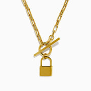 The 14K Yellow Gold Hollow Paperclip with Padlock and Square Toggle Necklace features rectangular links, a square toggle clasp, and a central gold padlock-shaped pendant.