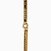 A close-up of the 14K Yellow Gold Snake Skin Design Necklace, showcasing its textured hexagonal pattern reminiscent of snake skin, displayed on a plain white background.