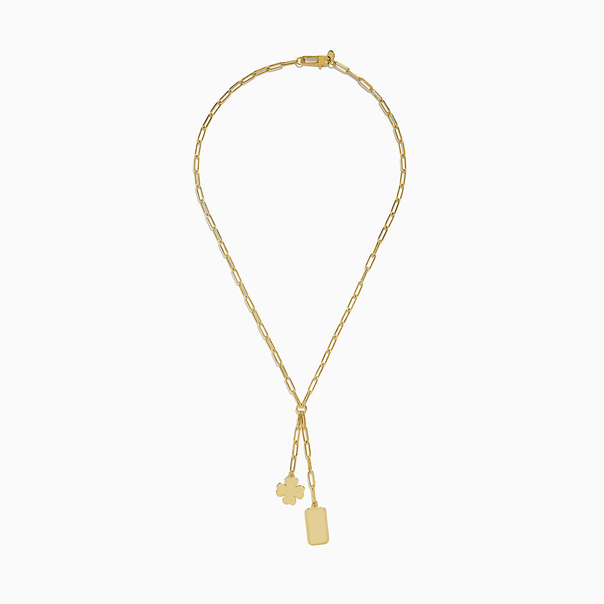 The 14K Yellow Gold Paperclip Dog Tag and Clover Lariat Necklace features elongated links with a four-leaf clover and rectangular tag charm side by side, crafted in 14K yellow gold and shown against a white background.