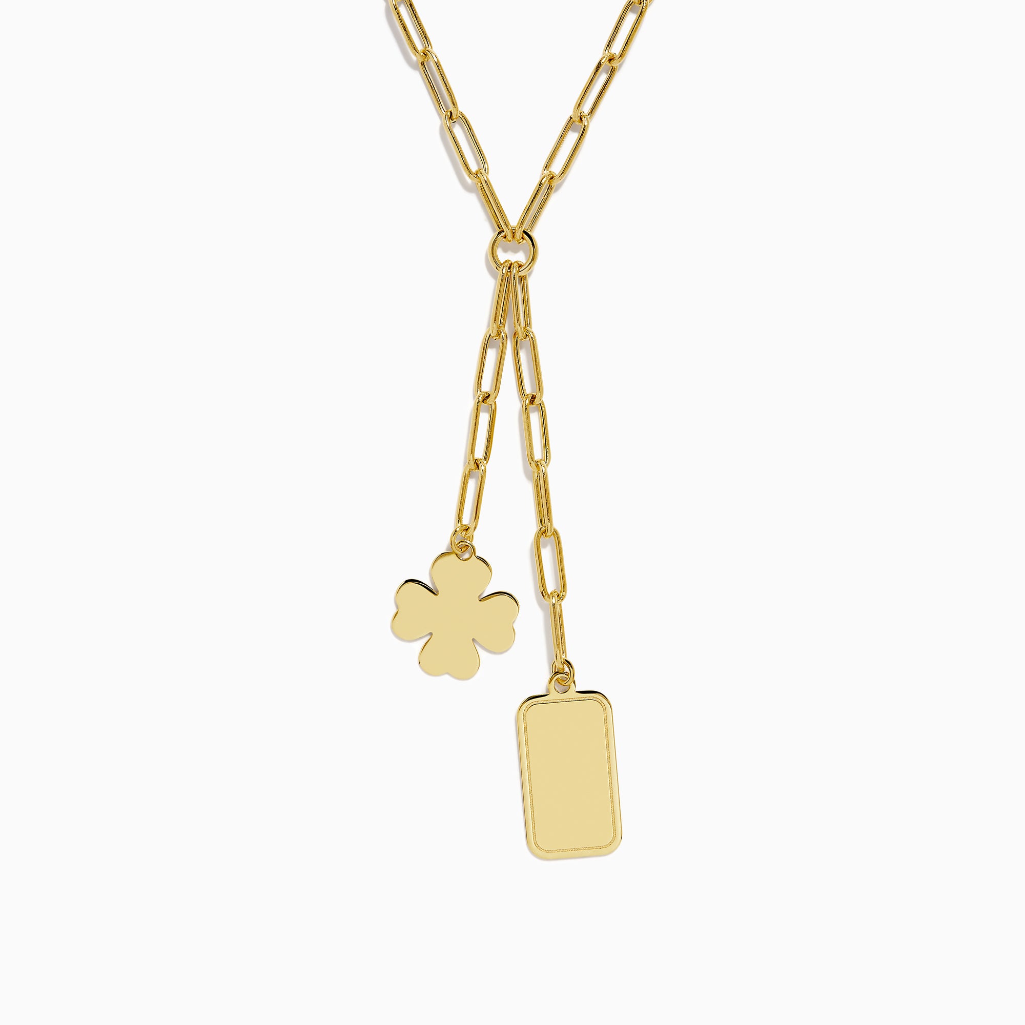 The 14K Yellow Gold Paperclip Dog Tag and Clover Lariat Necklace features elongated links with a four-leaf clover and rectangular tag charm side by side, crafted in 14K yellow gold and shown against a white background.