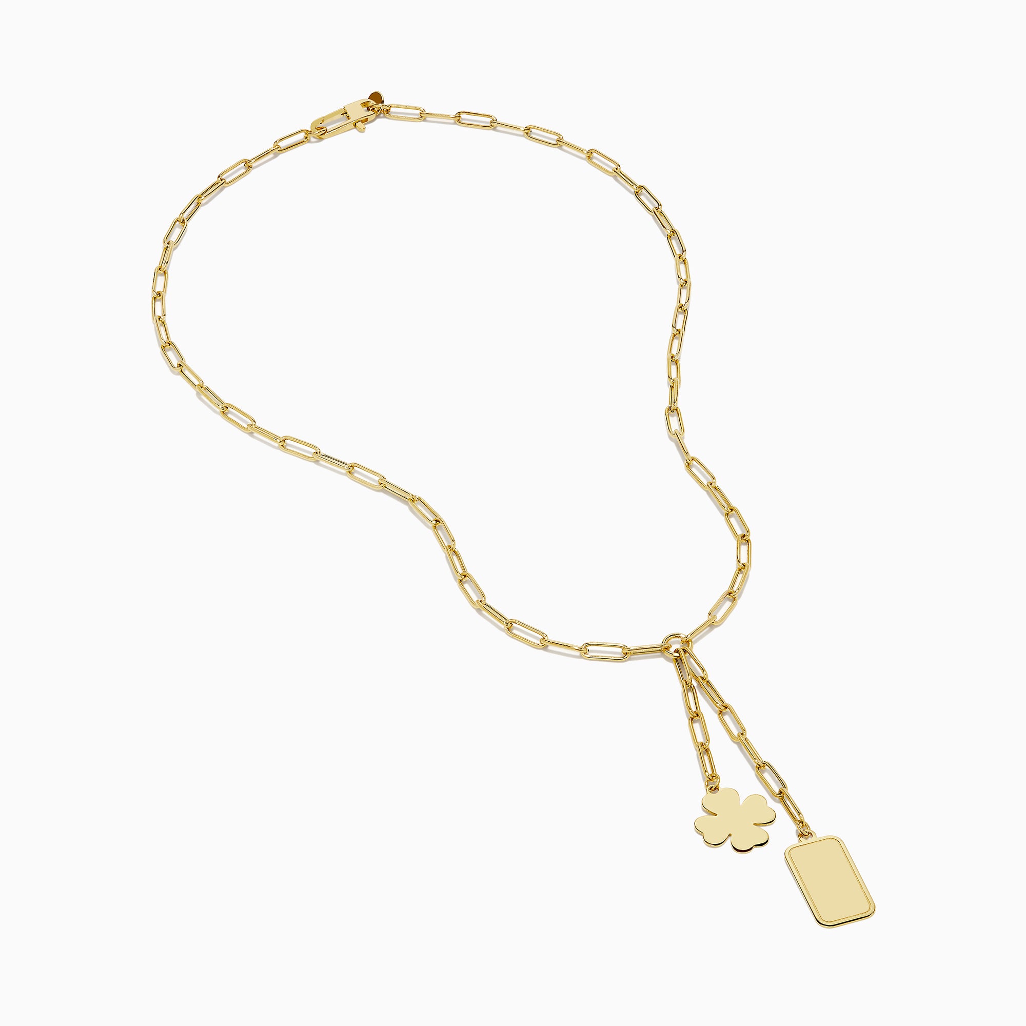 The 14K Yellow Gold Paperclip Dog Tag and Clover Lariat Necklace features elongated links with a four-leaf clover and rectangular tag charm side by side, crafted in 14K yellow gold and shown against a white background.