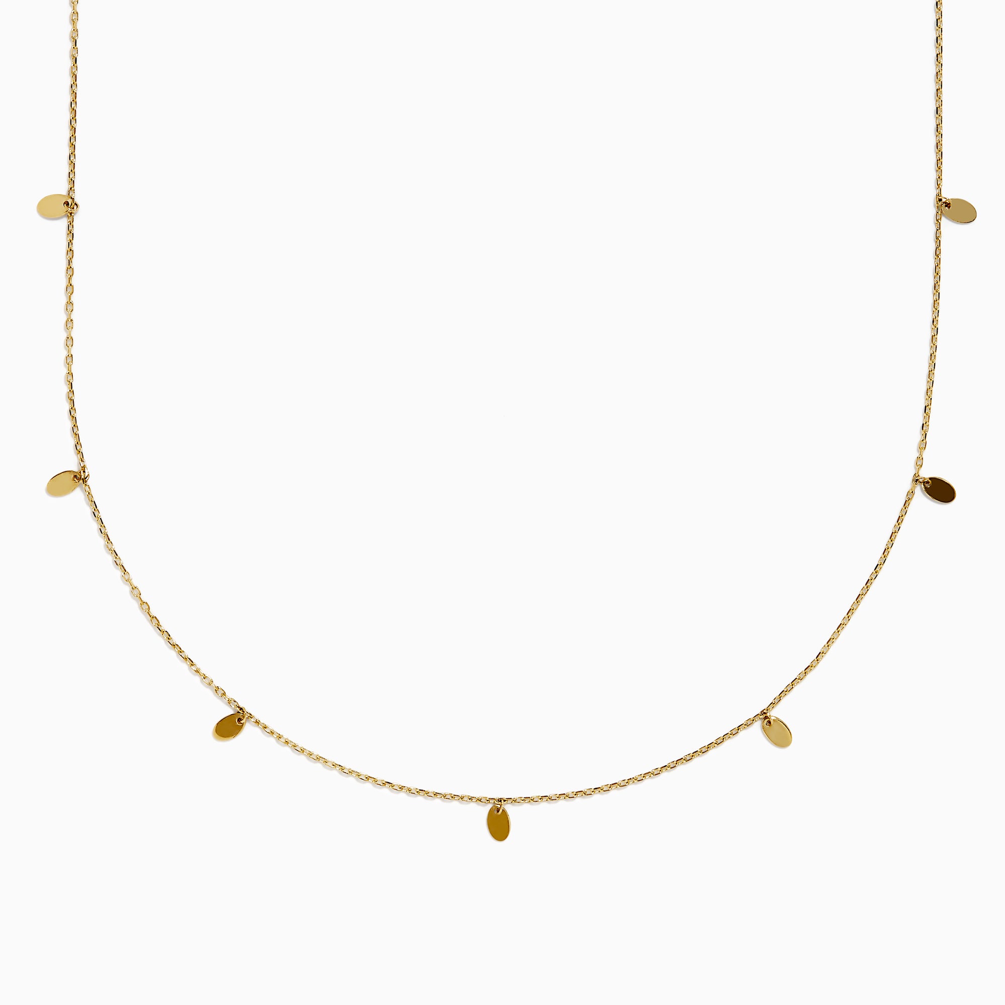 The 14K Yellow Gold Oval Charm Station Necklace features small, evenly spaced oval-shaped charms that hang gracefully along the lower half of a delicate yellow gold chain.