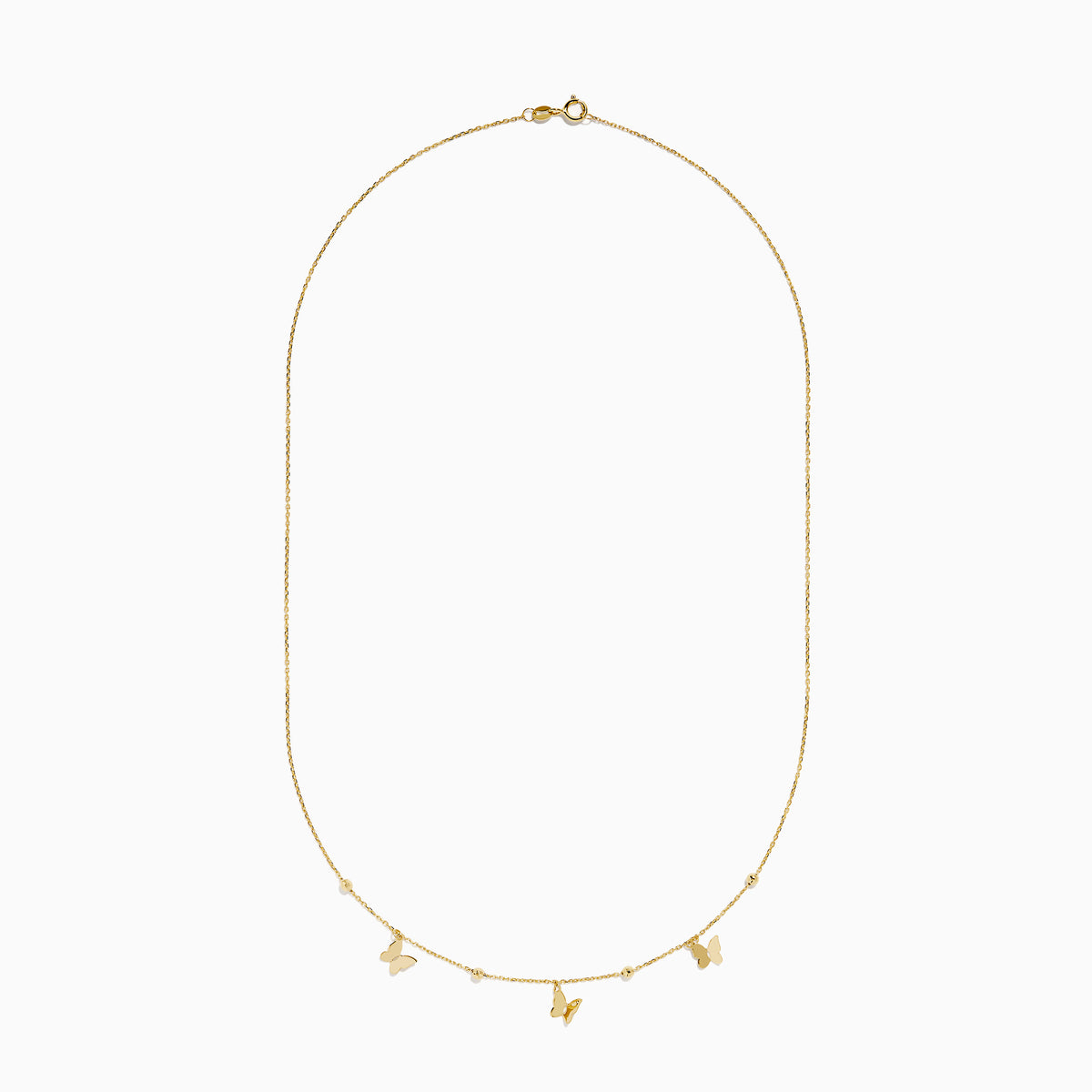 The 14K Yellow Gold Butterfly Station Necklace features three butterfly charms and four round beads evenly spaced along a delicate chain.