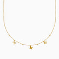 The 14K Yellow Gold Butterfly Station Necklace features three butterfly charms and four round beads evenly spaced along a delicate chain.