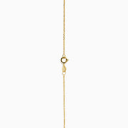 The 14K Yellow Gold Butterfly Station Necklace features three butterfly charms and four round beads evenly spaced along a delicate chain.