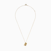 The 14K Yellow Gold Initial B Bubble Pendant shines on a delicate gold chain, displayed against a white background.