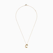 A 14K Yellow Gold Initial C Bubble Pendant displayed on a gold chain necklace against a plain white background.