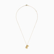 The 14K Yellow Gold Initial E Bubble Pendant sits on a thin chain, showcasing a bold, modern look against a plain white background.