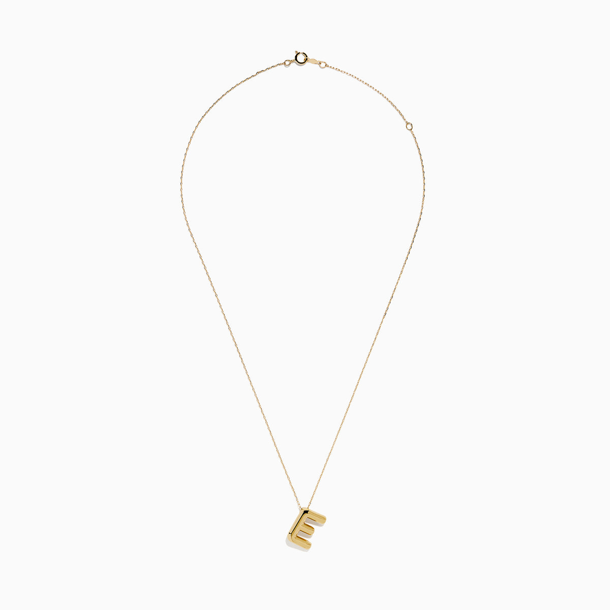 The 14K Yellow Gold Initial E Bubble Pendant sits on a thin chain, showcasing a bold, modern look against a plain white background.