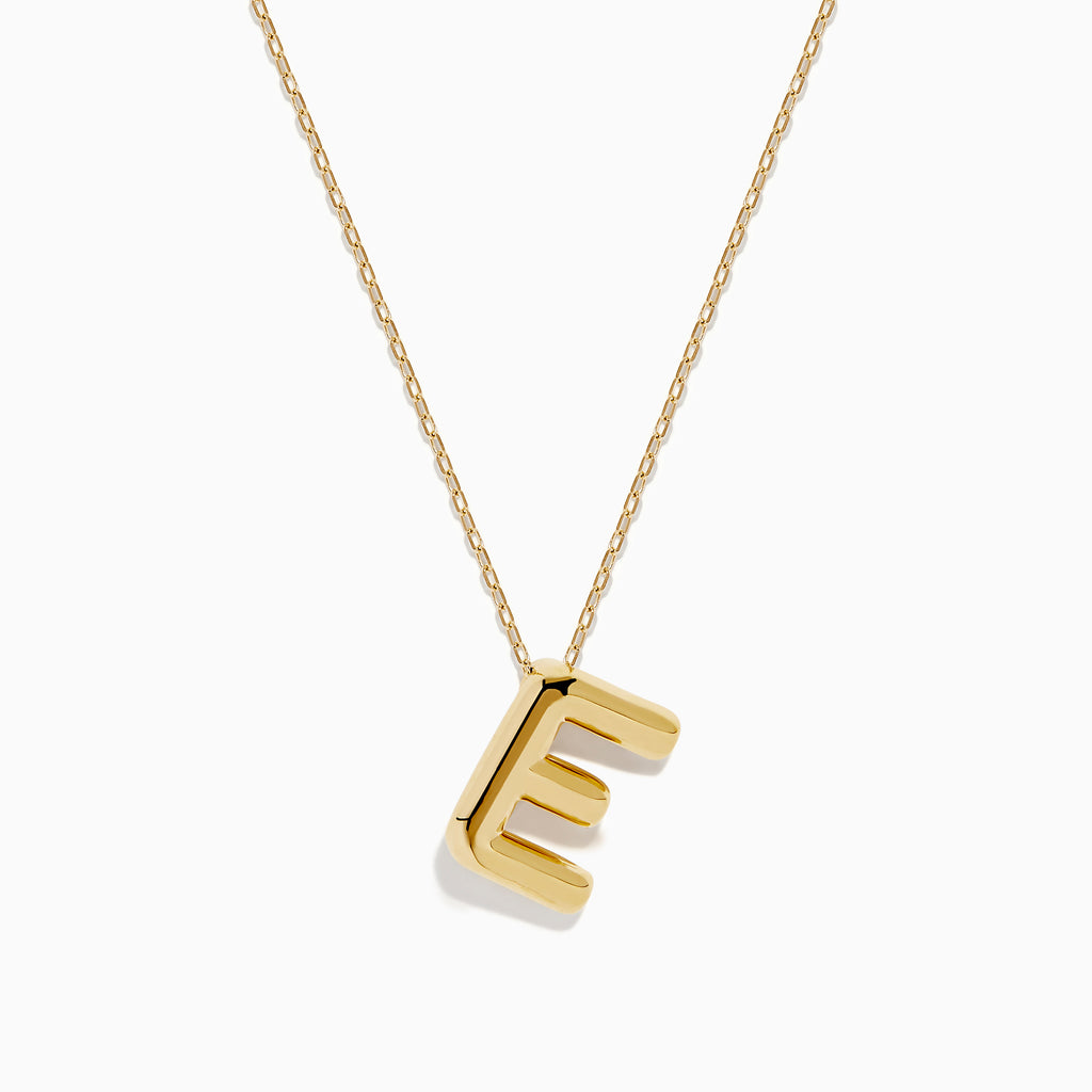 The 14K Yellow Gold Initial E Bubble Pendant sits on a thin chain, showcasing a bold, modern look against a plain white background.
