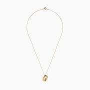 The 14K Yellow Gold Initial G Bubble Pendant is showcased on a delicate chain against a plain white background.