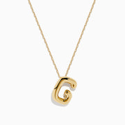 The 14K Yellow Gold Initial G Bubble Pendant is showcased on a delicate chain against a plain white background.
