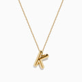 The 14K Yellow Gold Initial K Bubble Pendant features a bubble design initial on a delicate chain, shown against a plain white background.