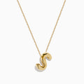 A delicate 14K yellow gold necklace featuring the S Bubble Pendant, sculpted with a shiny finish.